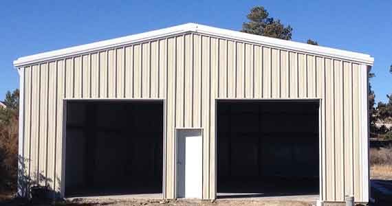 Compact two-bay garage in a painted panel finish.